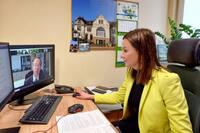 Director of the Department of Regional Projects at the Marshal's Office, Agnieszka Potkańska-Ćwikła at a desk talking in a videoconference.