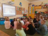Children watching cartoons on TV.