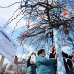 Patchwork authors under a decorated tree.
