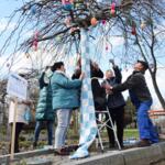 Patchwork authors under a decorated tree.