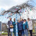 Patchwork authors under a decorated tree.