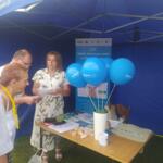 Event guests at the eco-manager's stand.