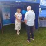 Event guests at the eco-manager's stand.