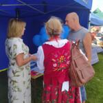 Event guests at the eco-manager's stand.