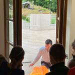 An eco-manager with a group of children conducting physical experiments.