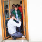 An eco-manager with a group of children conducting physical experiments.