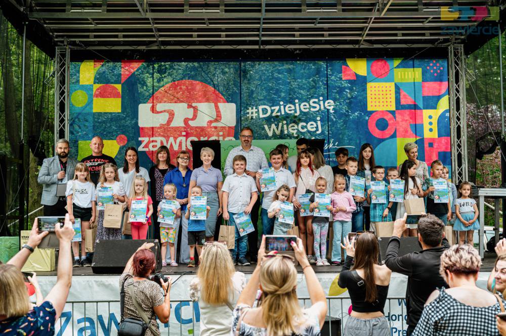 A group of competition winners on stage during the award ceremony.