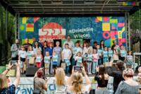 A group of competition winners on stage during the award ceremony.