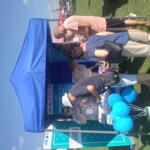 Guests visiting the booth.