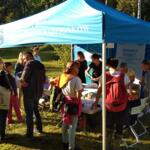Several people are standing in front of the eco-manager's booth.