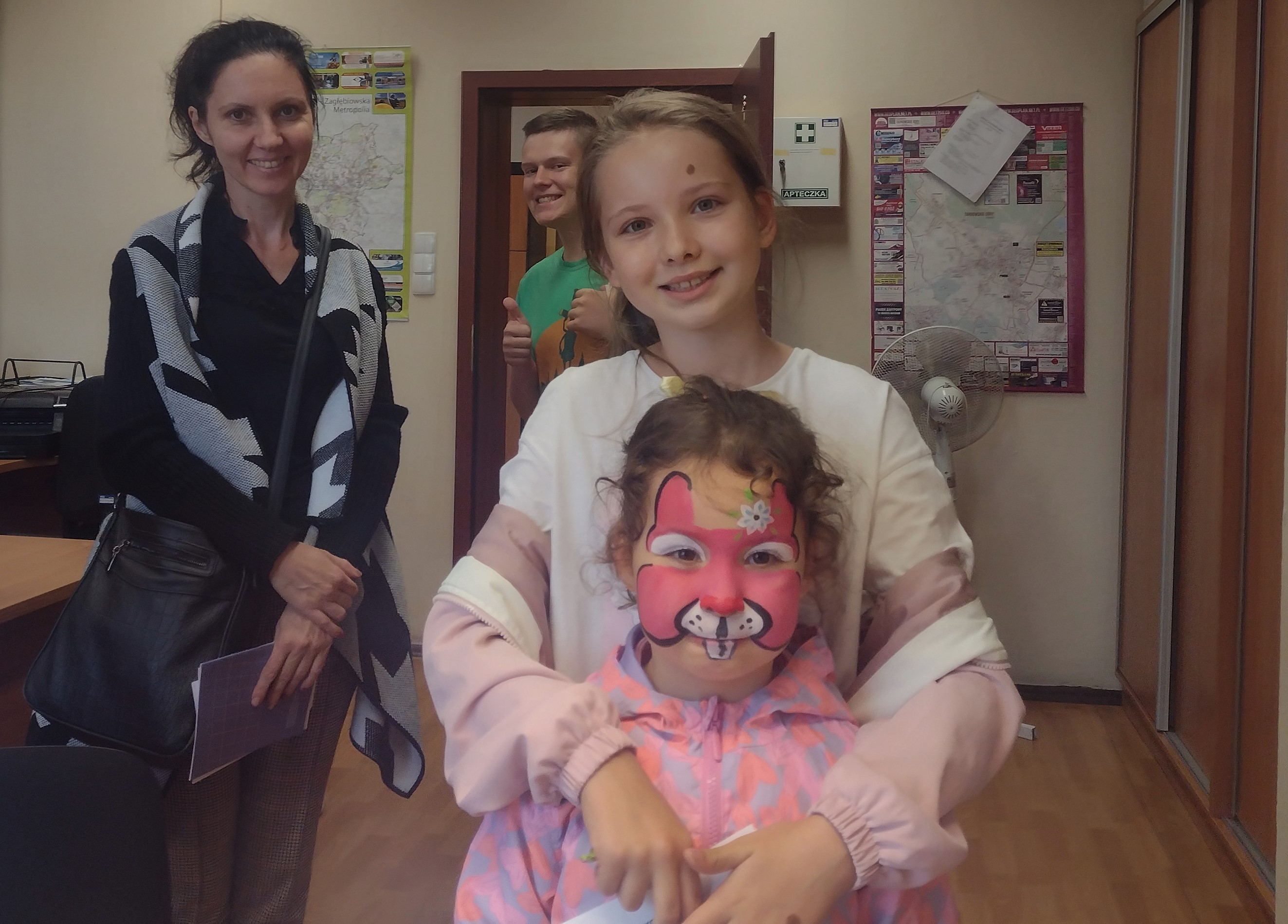 A family in the eco-manager's office.