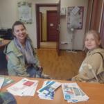 A family in the eco-manager's office.
