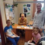 A family in the eco-manager's office.