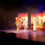 Actors from the play on the stage.