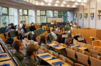 Group of youth sitting in benches during the Olympiad.