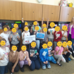A group of participants holding certificates of participation.