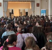 Students watching the performance.