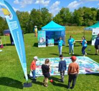 Children playing a large board game.